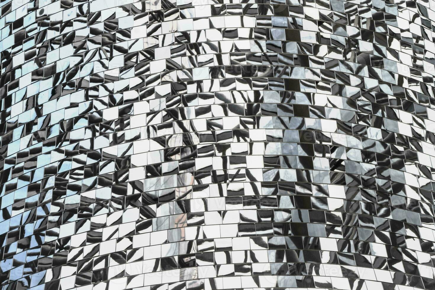Mosaic of mirror pieces with reflection. Abstract mirror background made up of mirror fragments photo