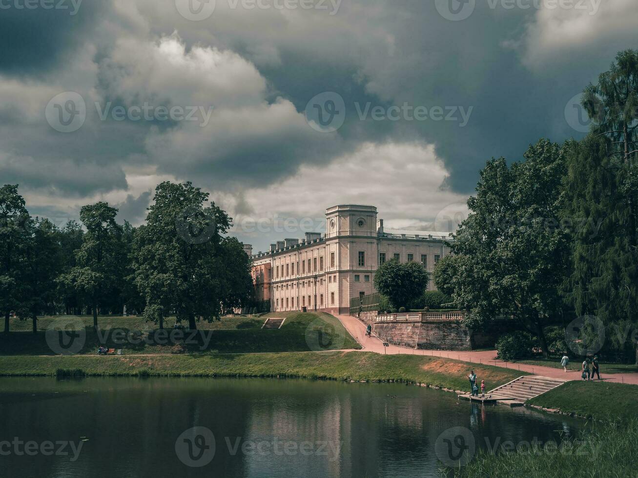 Beautiful summer landscape of the Park with a pond and a Great Gatchina Palace. Russia photo