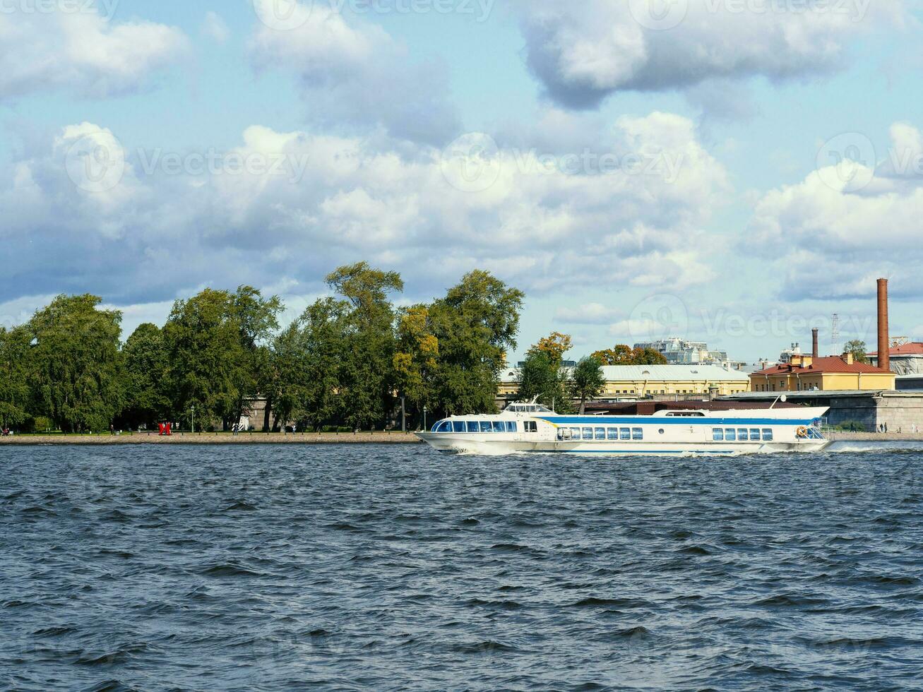 Saint-Petersburg. Speed boat taxi sailing on the river Neva photo