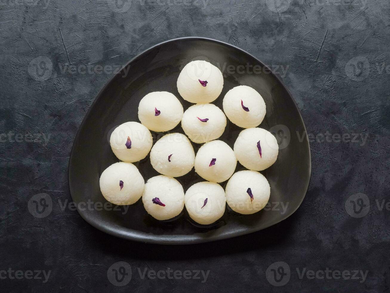 Sponge Rasgulla sweets, famous indian sweet food. Top view photo