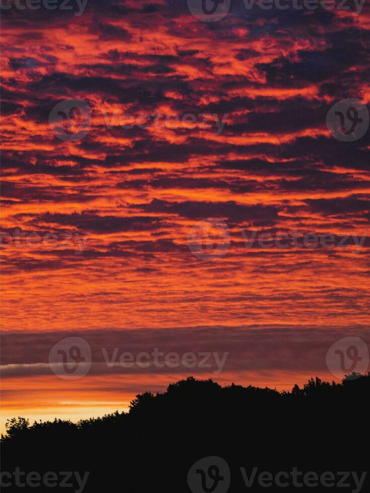 Red evening sky. Colorful cloudy sky at sunset. Sky texture, abstract nature background photo