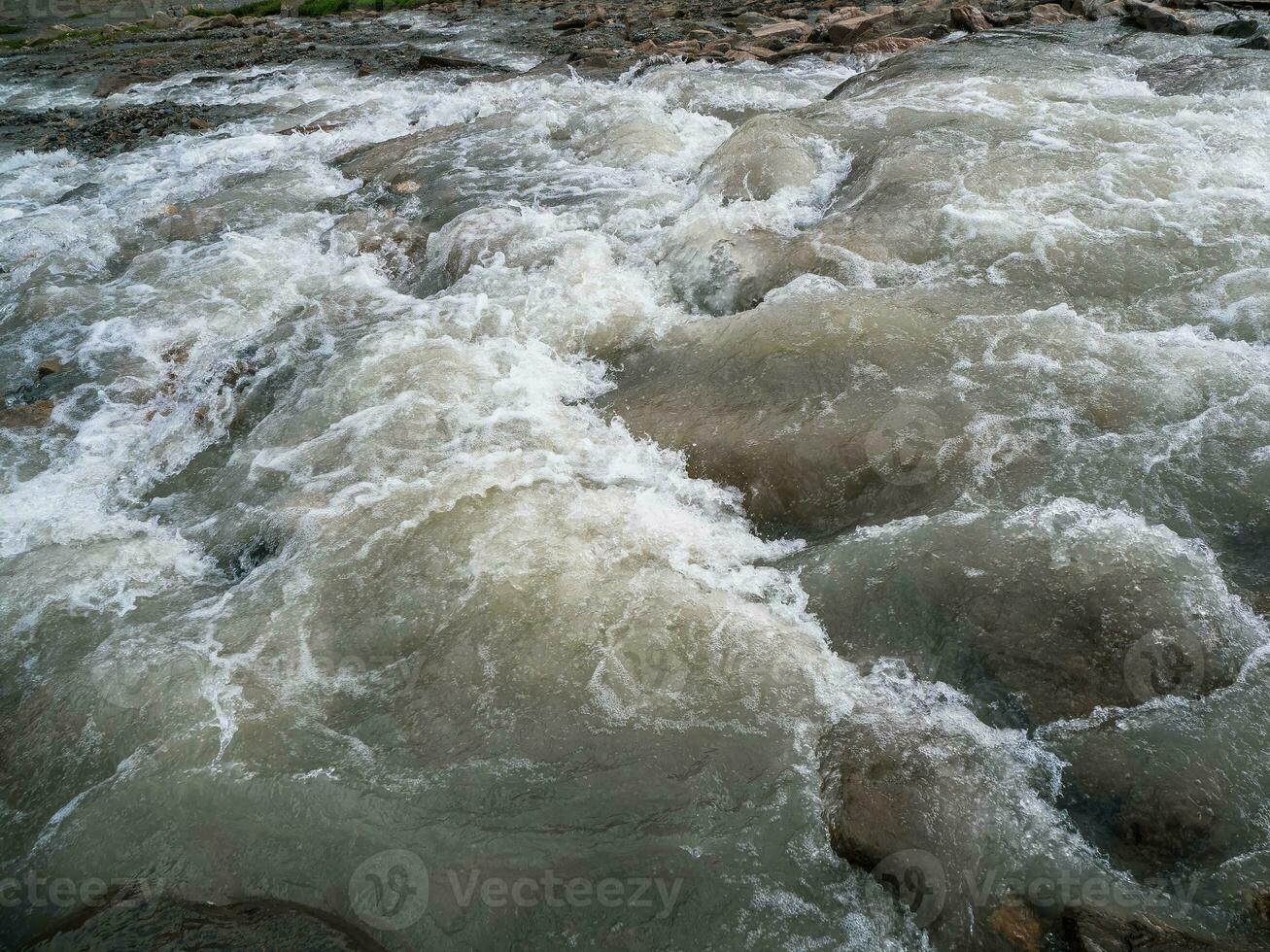 Breakers on the water close up. Powerful stream of water washing away everything. photo