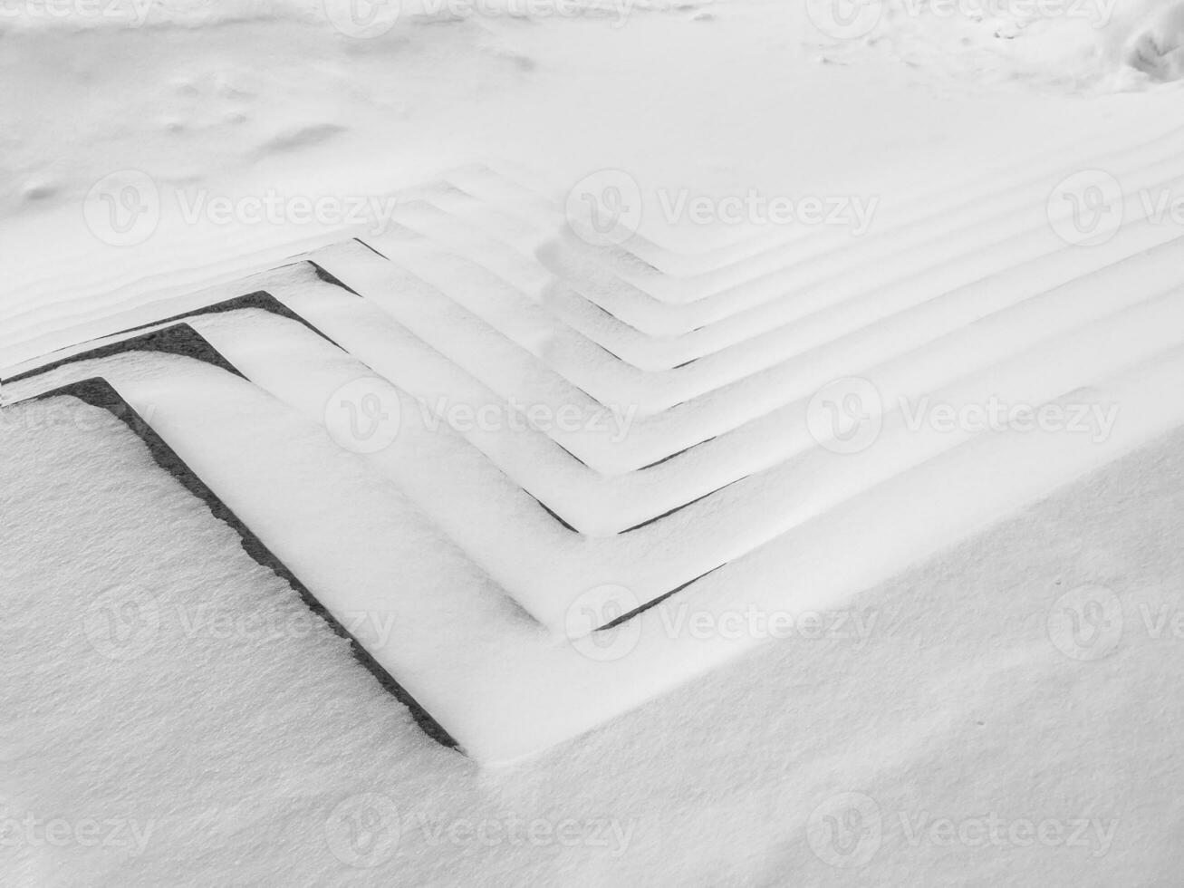 Snowy monochrome graphics. The staircase is zigzagged with snowdrifts. Abstract graphic winter background. photo