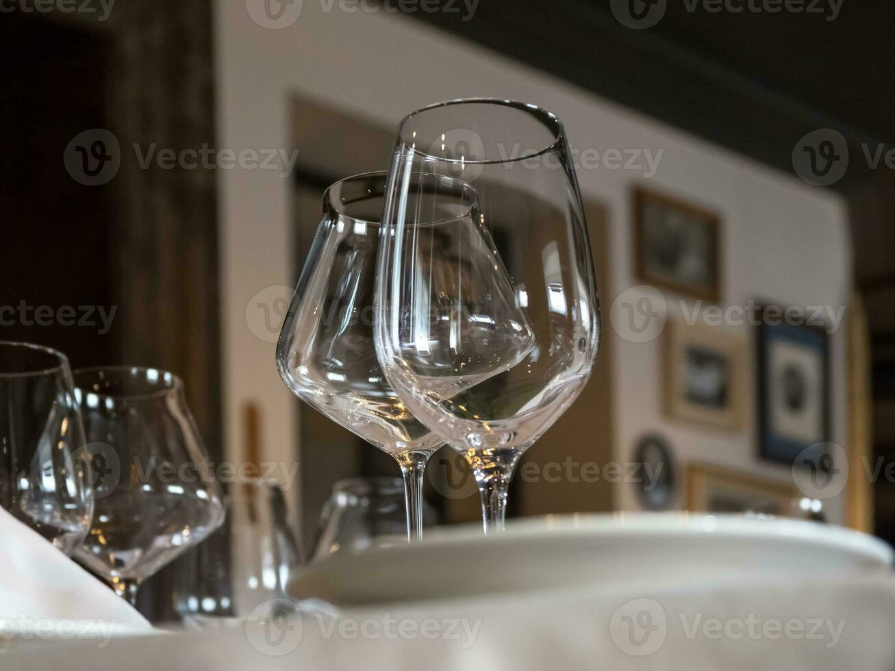 Empty wine glasses are served on the table. photo