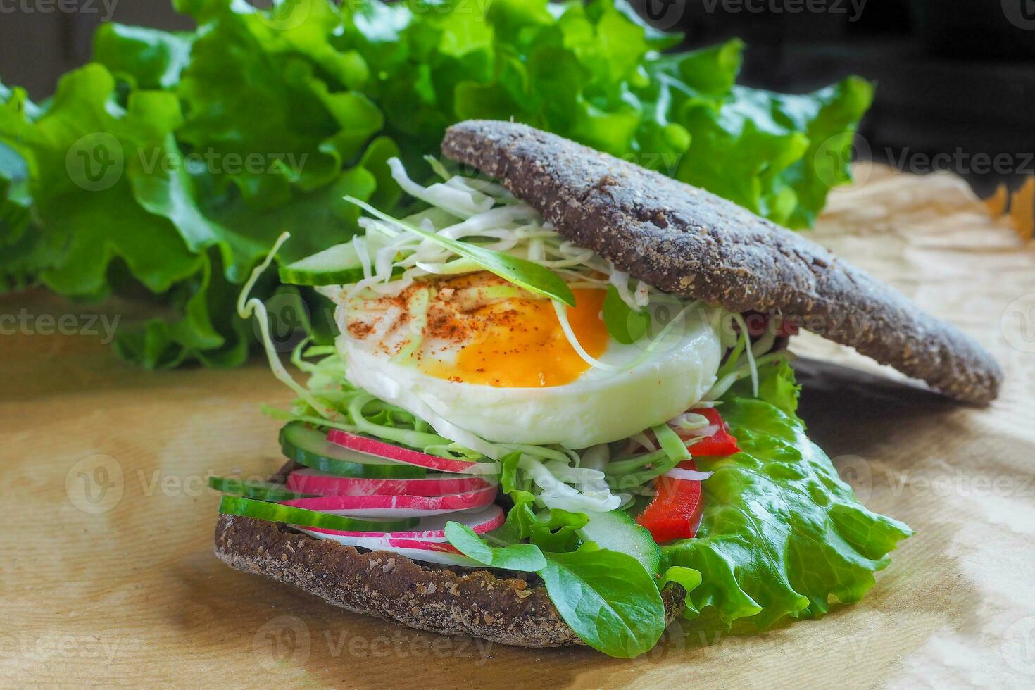 sandwich with egg and lettuce leaves photo