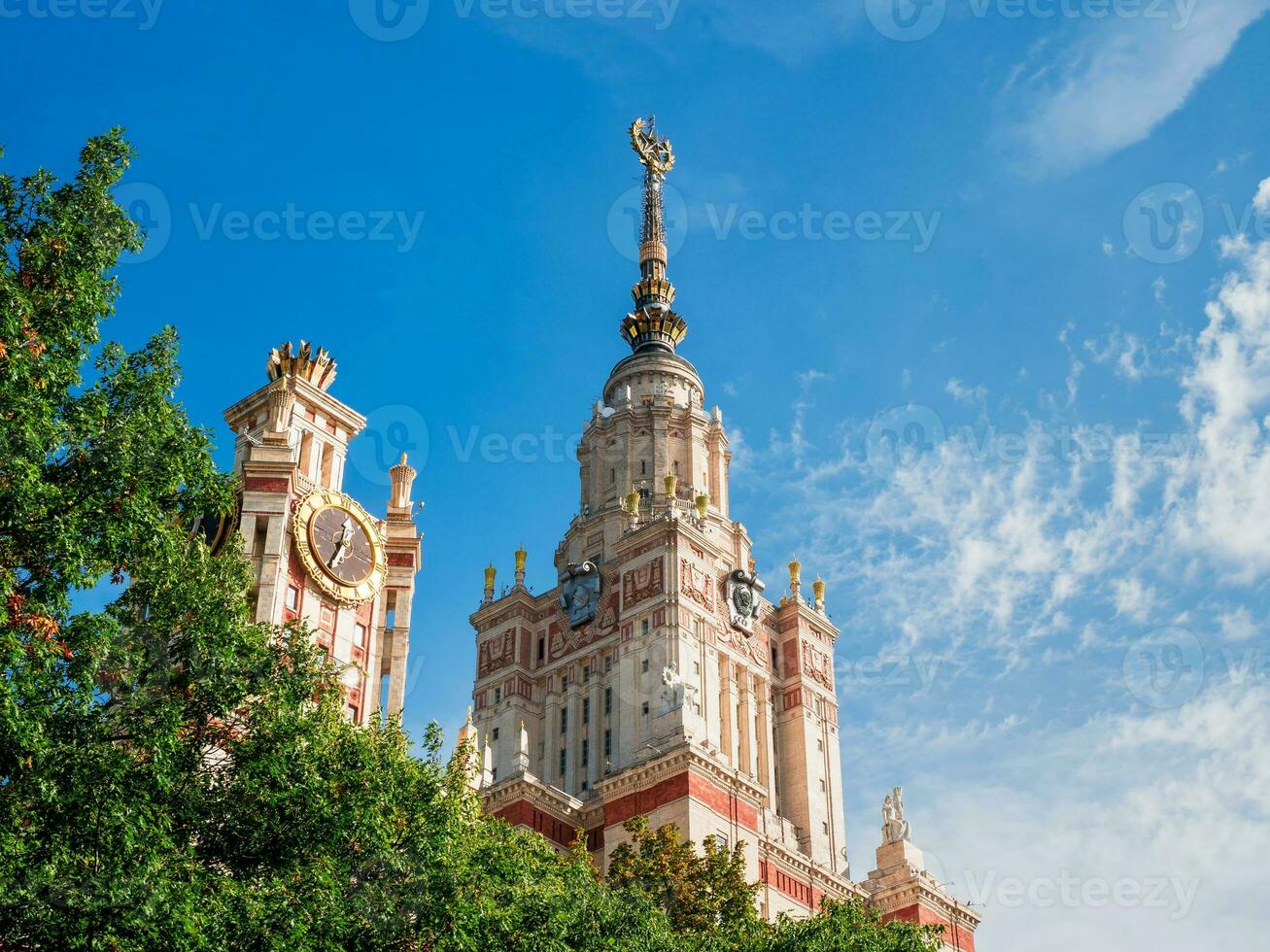 Fragment of a building with a spire, the state University in Moscow against the blue sky photo