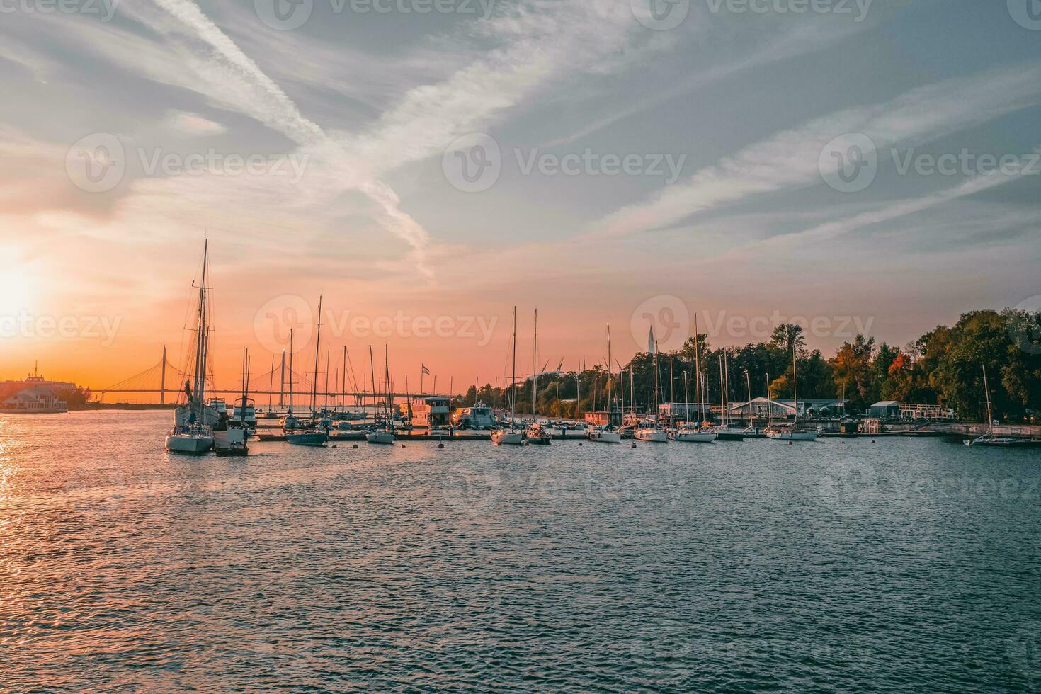 Motor and sailing yachts are moored in the marina of the yacht club. Saint-Petersburg. photo