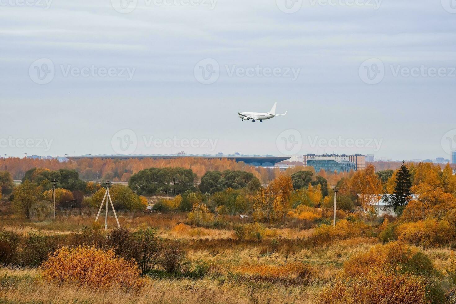 Big white airliner on approach to the airport. Flight restrictions, sanctions on air transportation and passenger flights. The crisis of relations between countries concept. photo