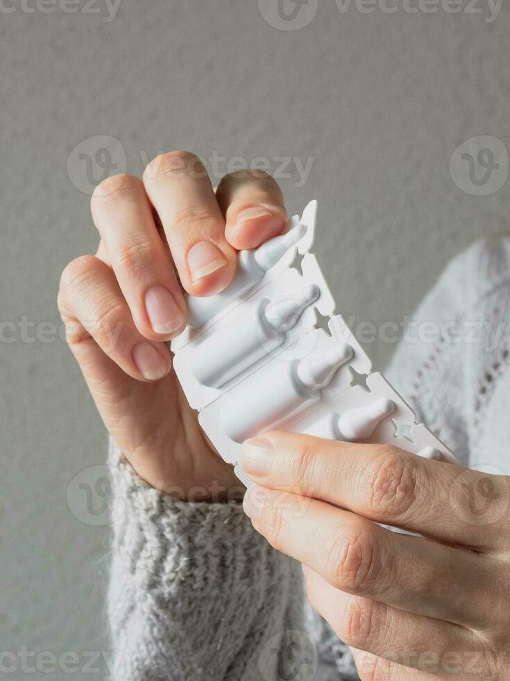Plastic ampoules with medicine or vaccine close-up. Modern medicine concept. Complex of humic and fulvic acids promotes adaptation to active life after illness and restores the balance of the body. photo