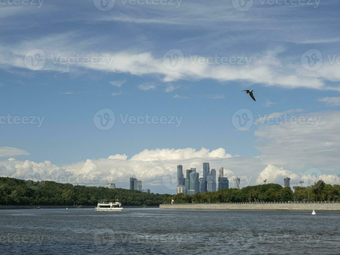 Tourist ship floating on the river. View of the Moscow river and Sparrow hills. photo