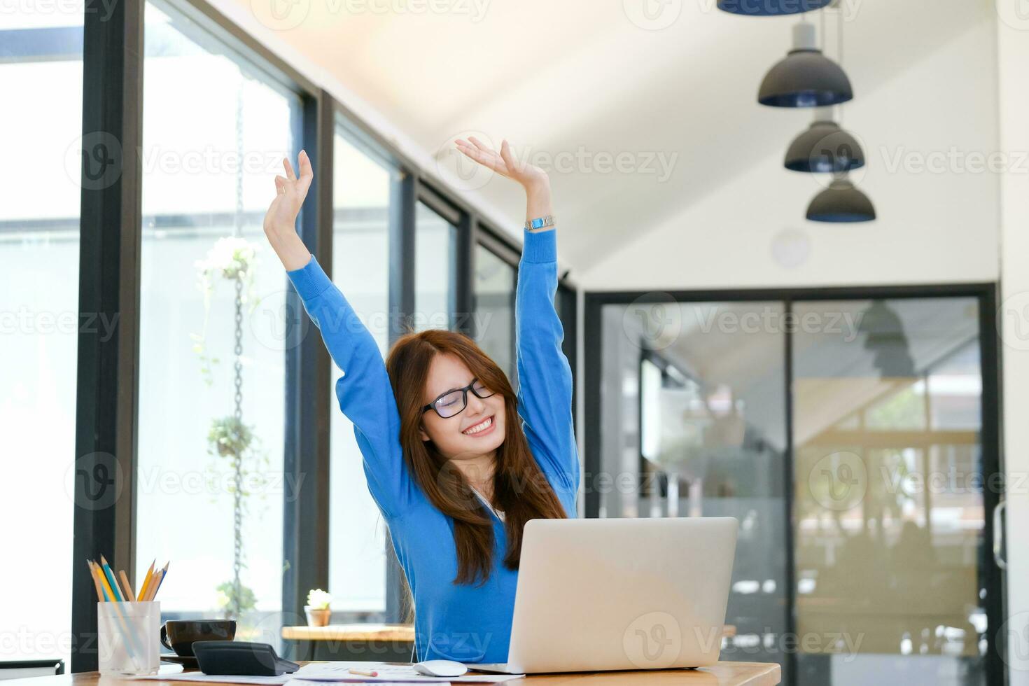 Enjoy young woman celebrate success or happy pose. photo