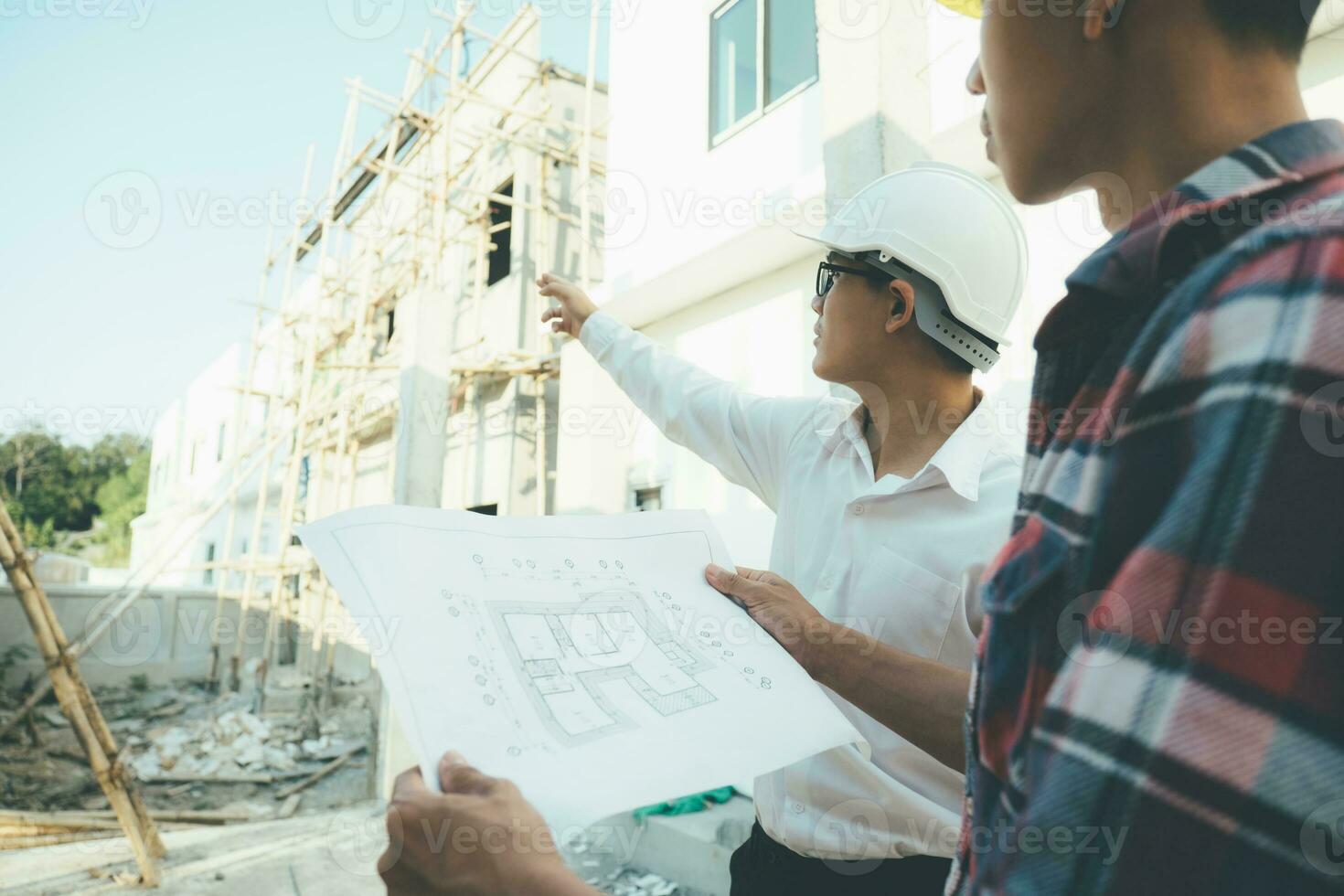 The engineering team working at building site meeting and discussing. photo