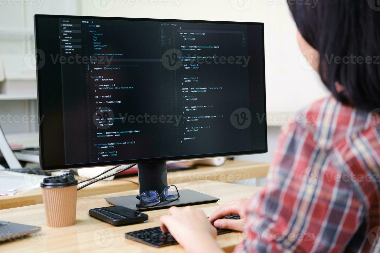 Programmers and developer teams are coding and developing software photo