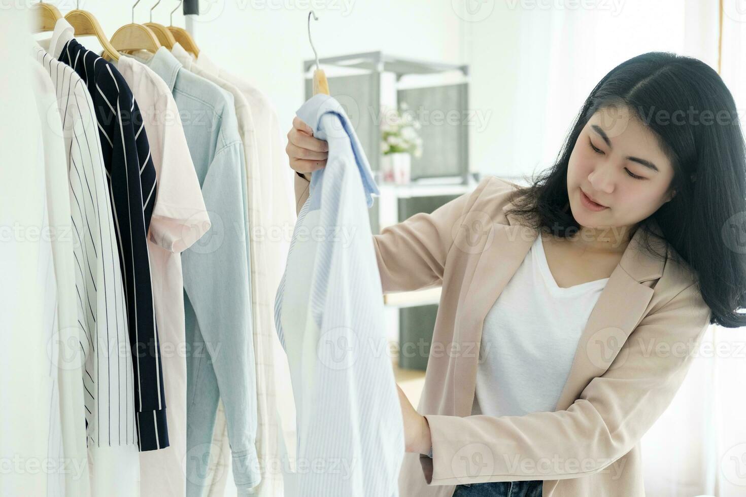 Businessowner checking clothes in small business. photo