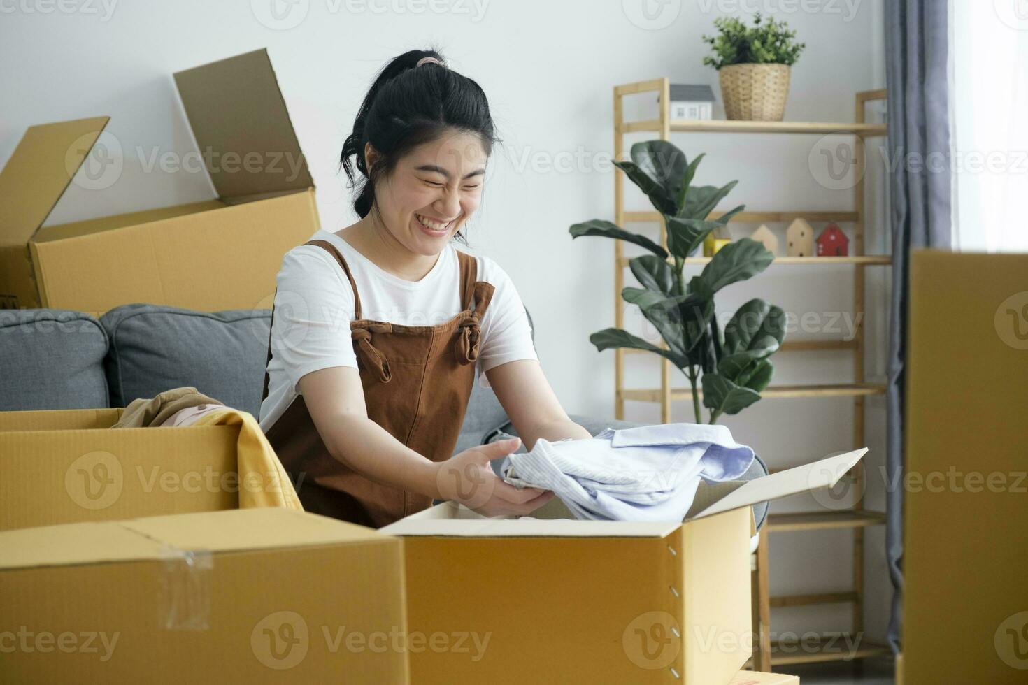 Modern female people in moving home apartment leisure indoor activity alone. photo