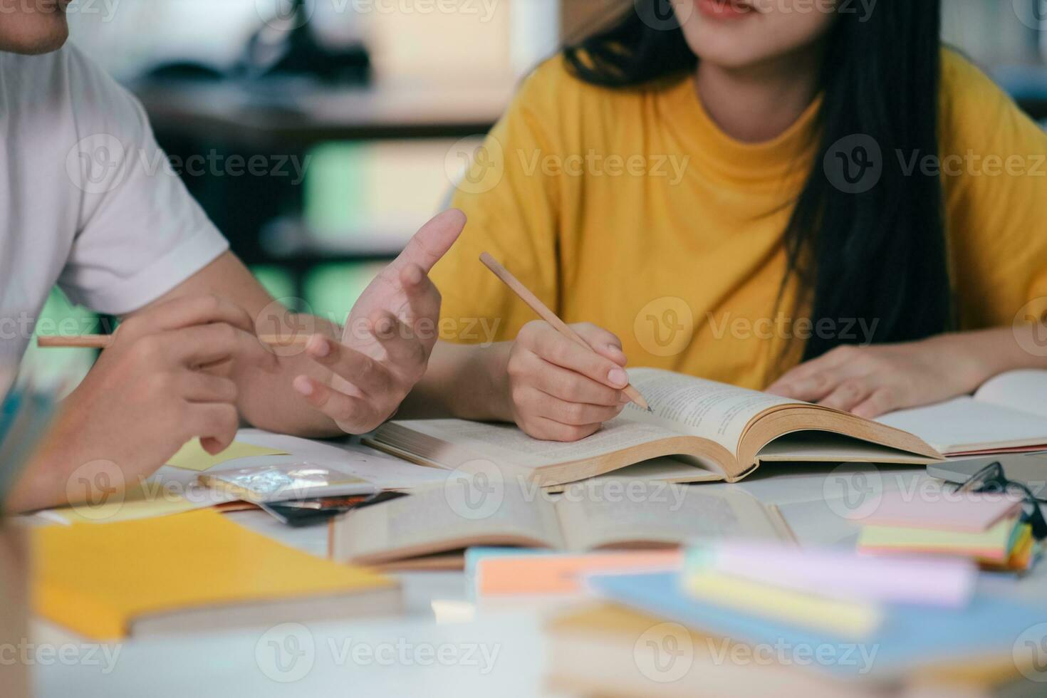 Young students campus helps friend catching up and learning. photo