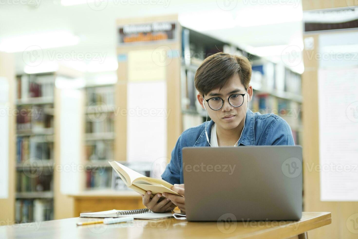 Student studying at library. photo