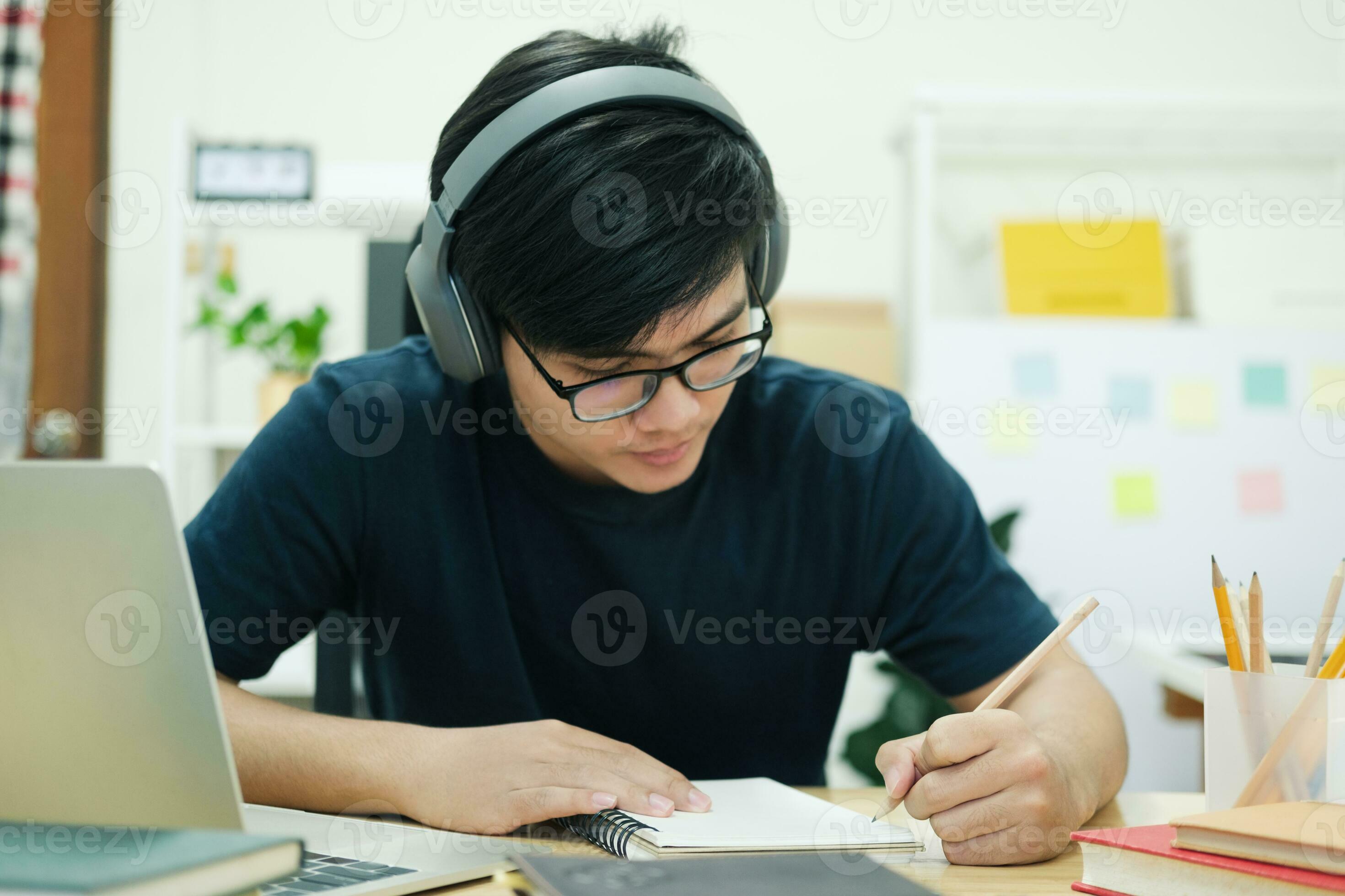 Young man study in front of the laptop computer at home 24770390 Stock ...