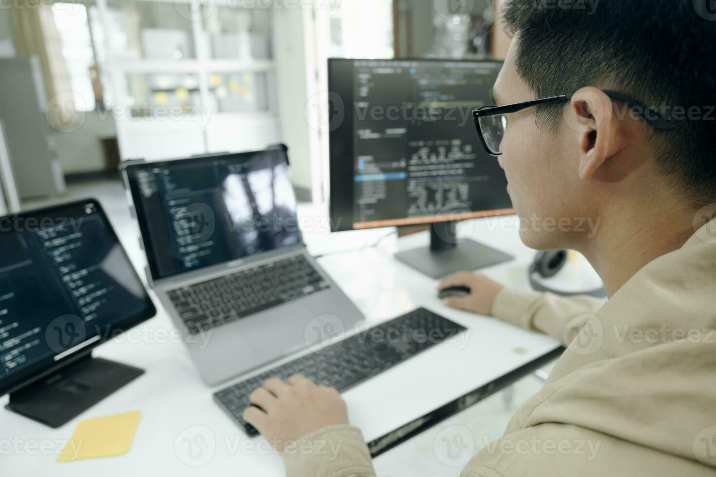 Programmers and developer teams are coding and developing software photo