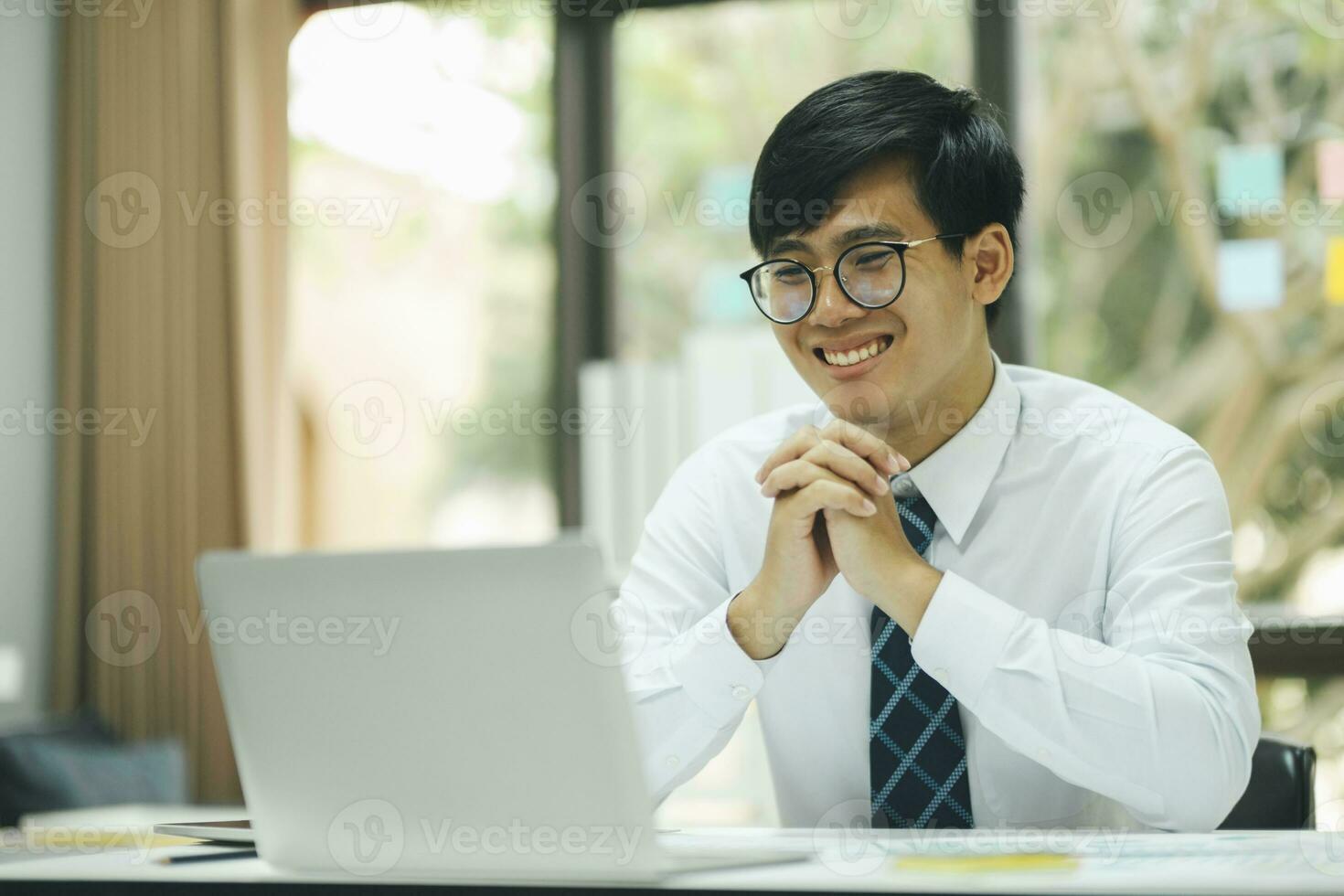 Young businessman work using laptop. photo