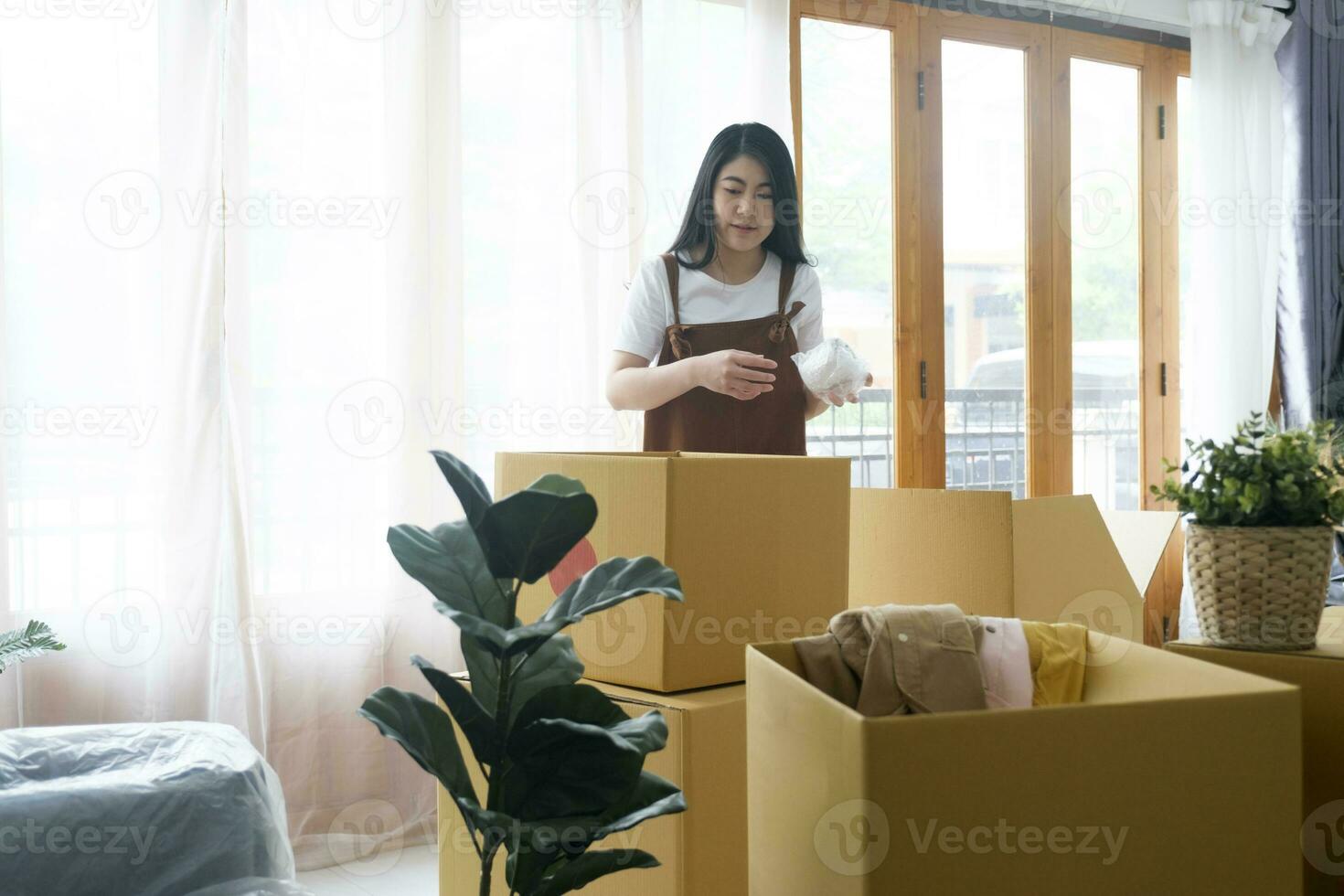 Modern female people in moving home apartment leisure indoor activity alone. photo