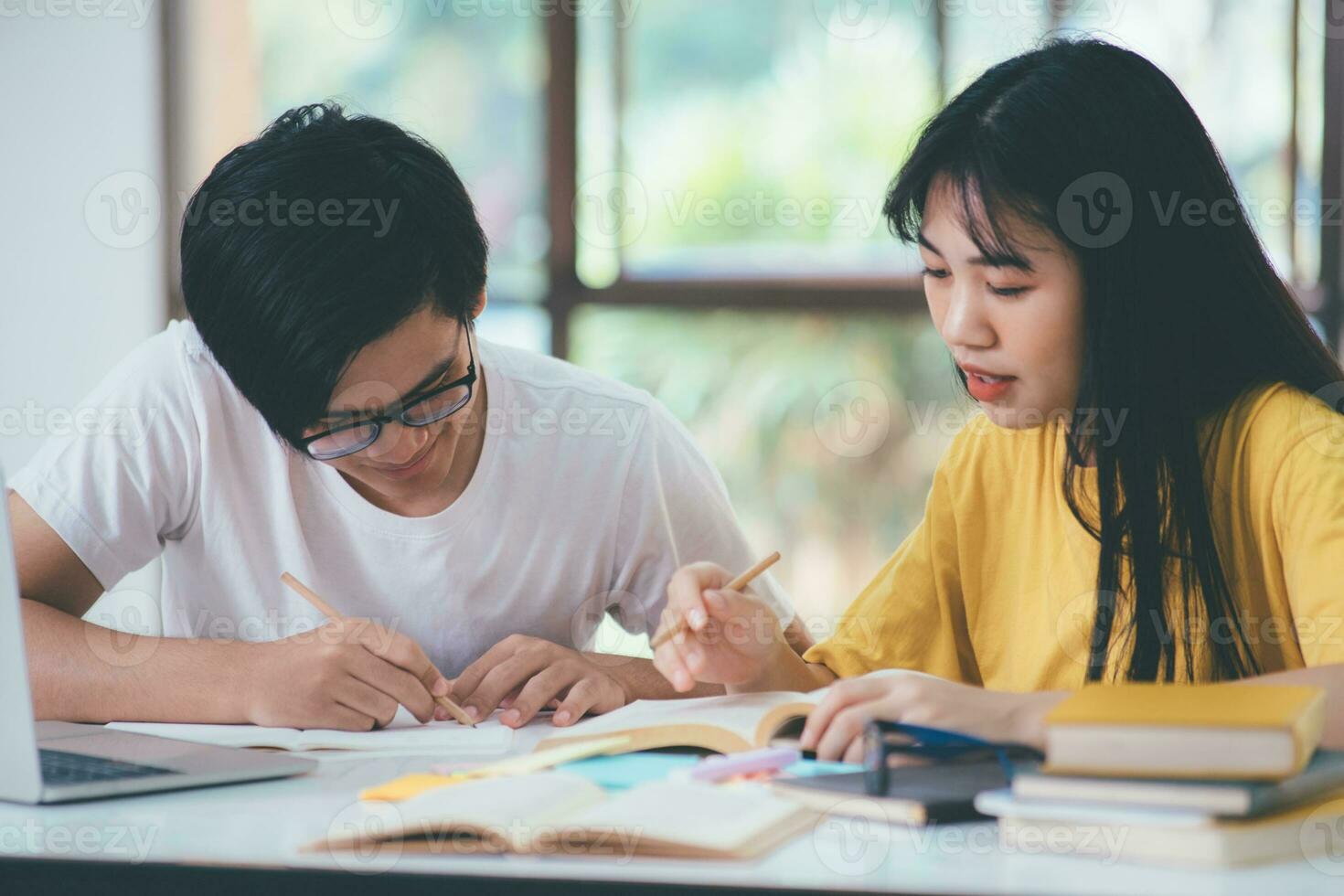 An asian students are reading books and study, Tutoring together. photo