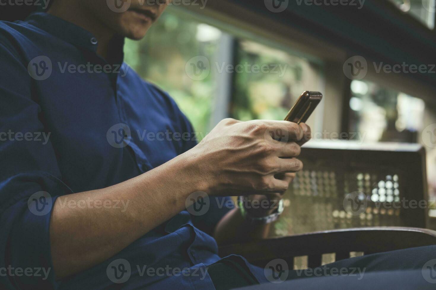 Close up of man using mobile phone. photo