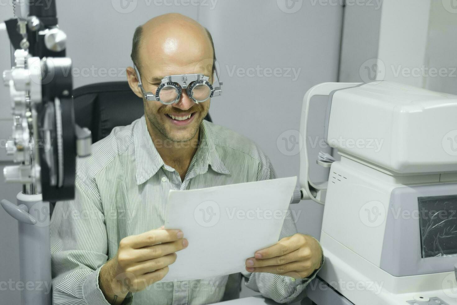 Man examining eyesight in optical clinic. photo