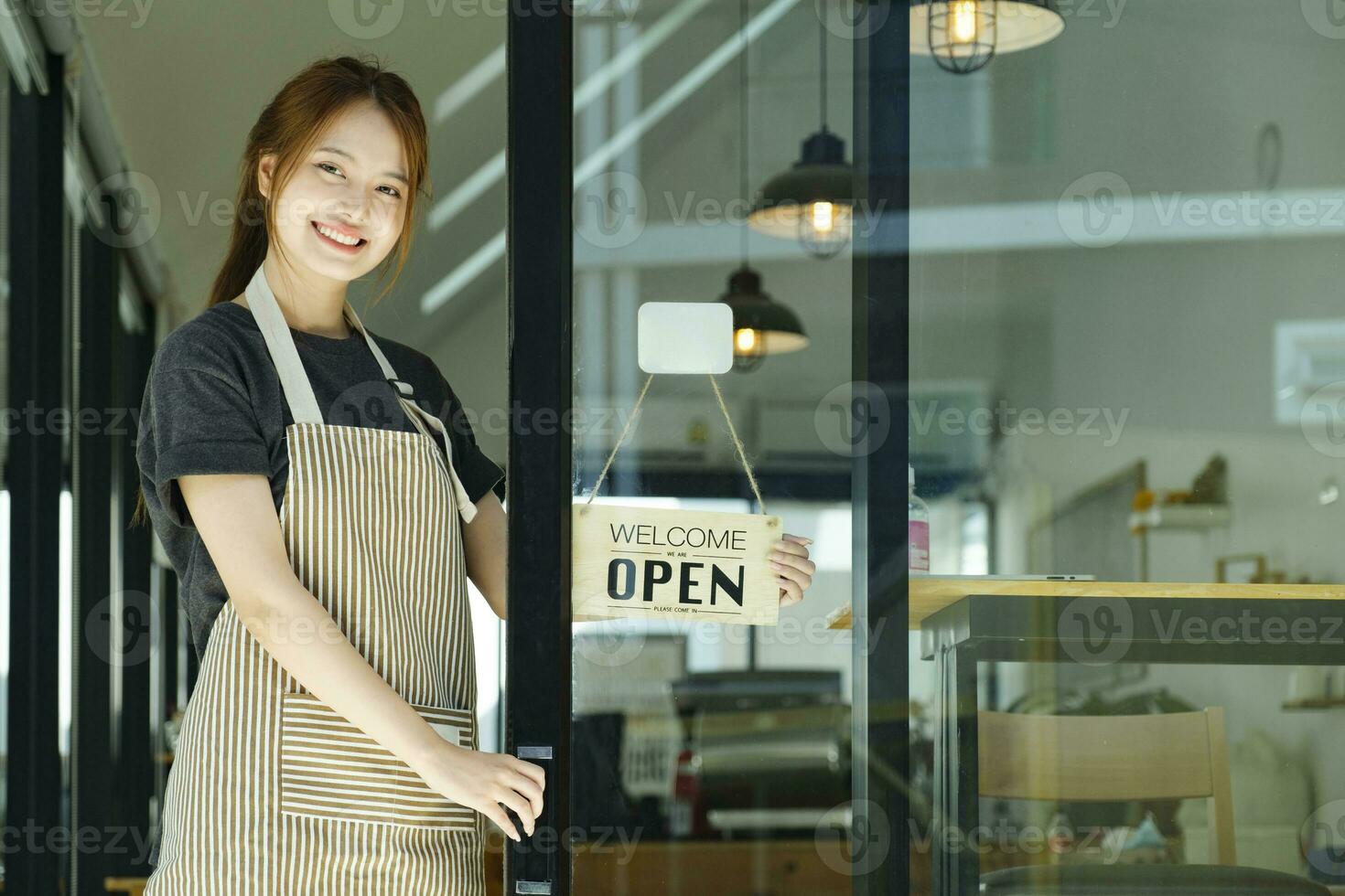 Young business owner open the coffee shop. photo