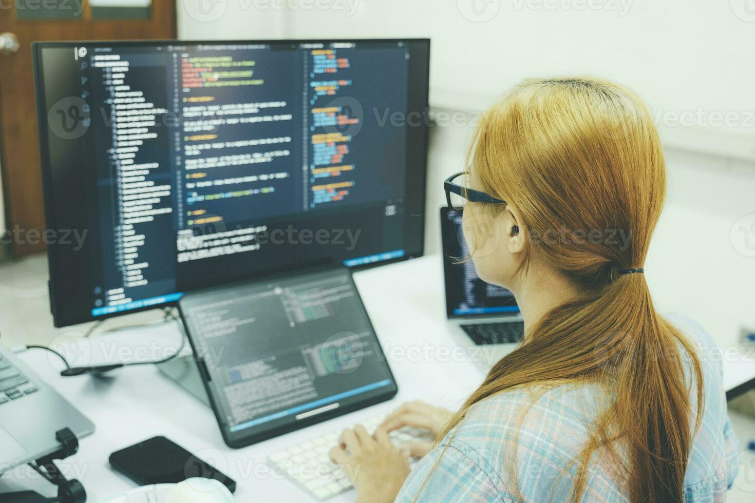 Programmer is coding and programming software. photo