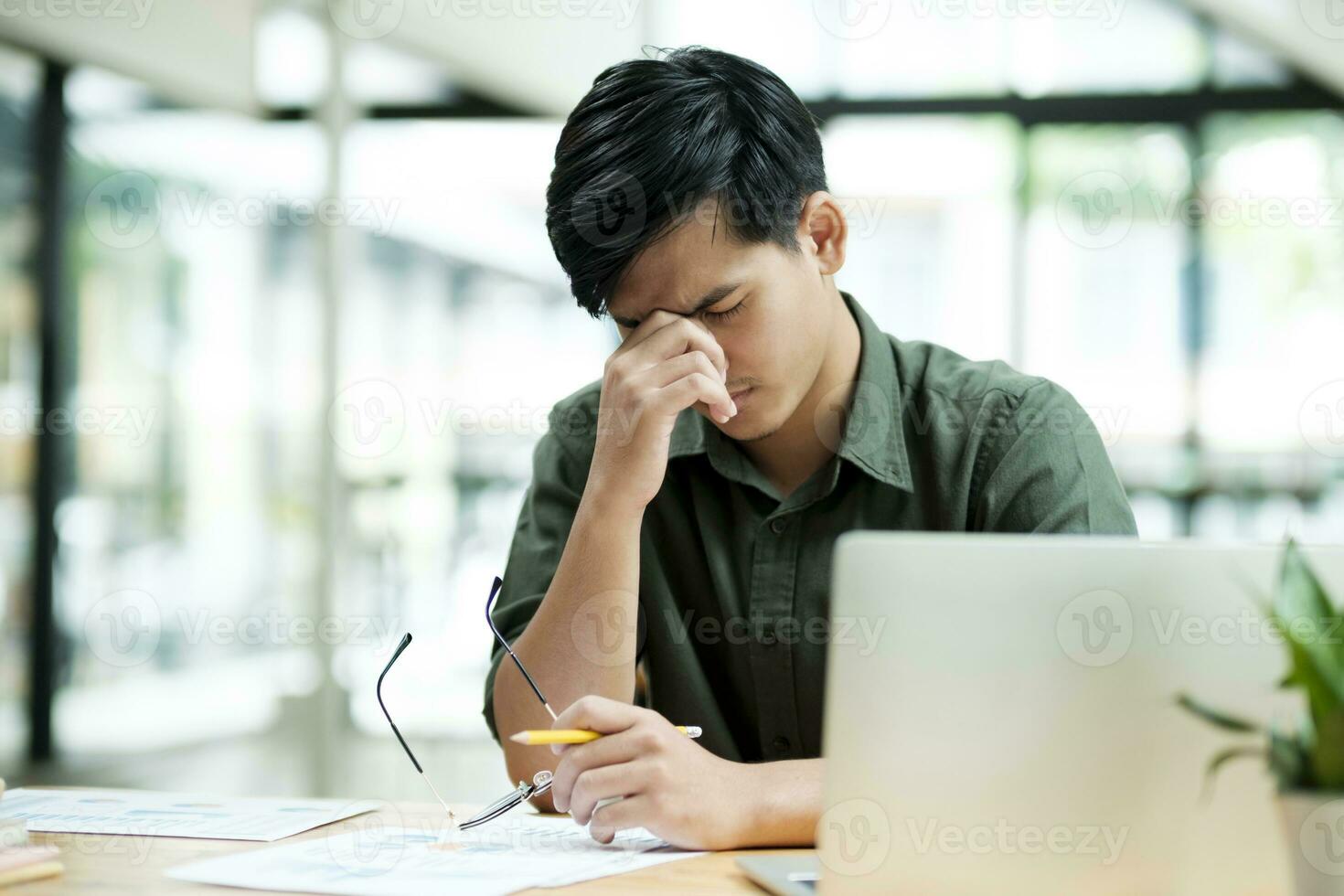 Stressed overwork businessman in the office. photo