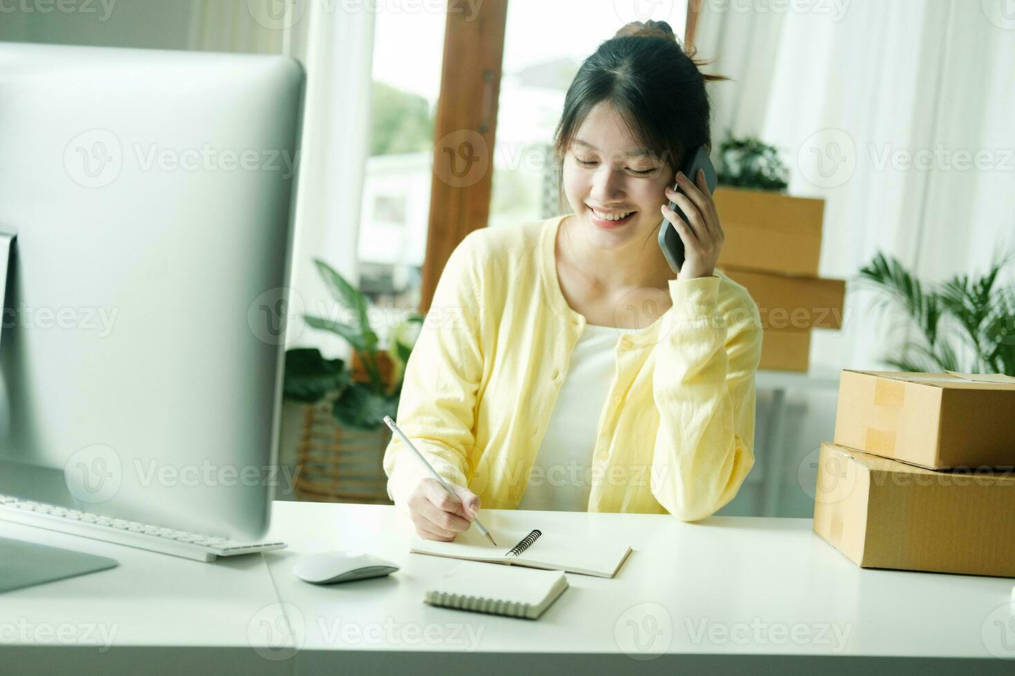 Asian business owner always keep contact with customer. photo
