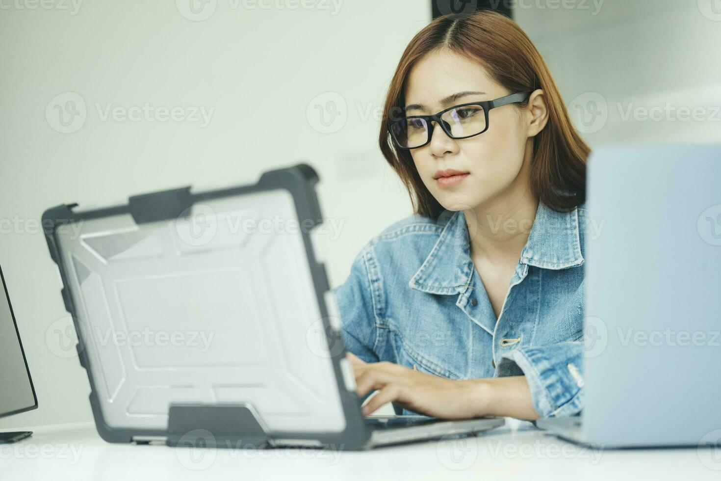 Young programmer or IT specialist satisfied with her work done. photo
