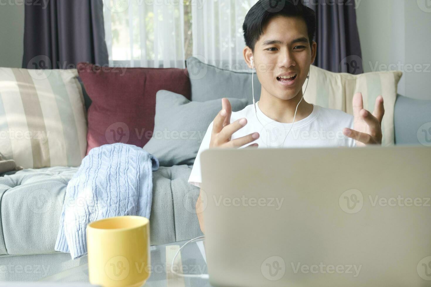 Young man working and studying online at home. photo