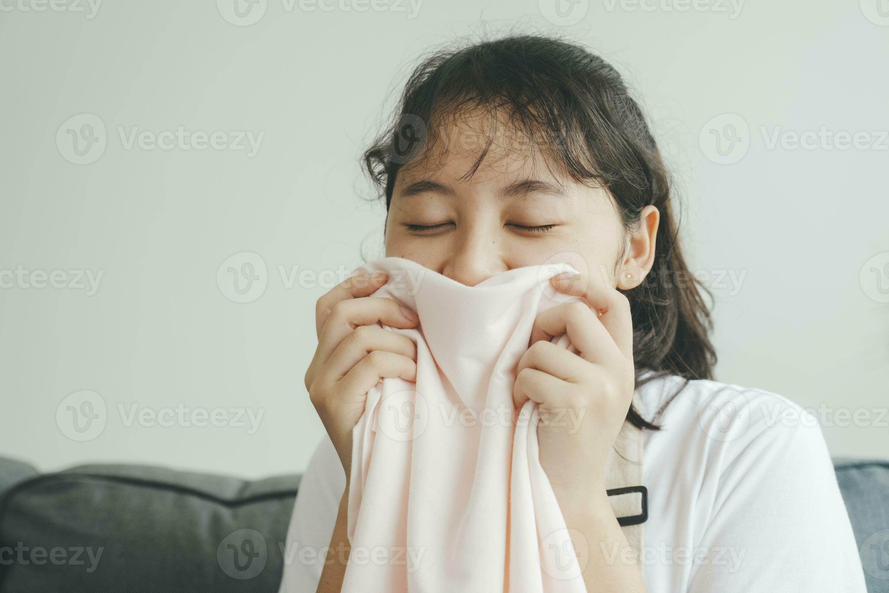 Woman on sofa smell clean luandry at home. 24771289 Stock Photo at Vecteezy