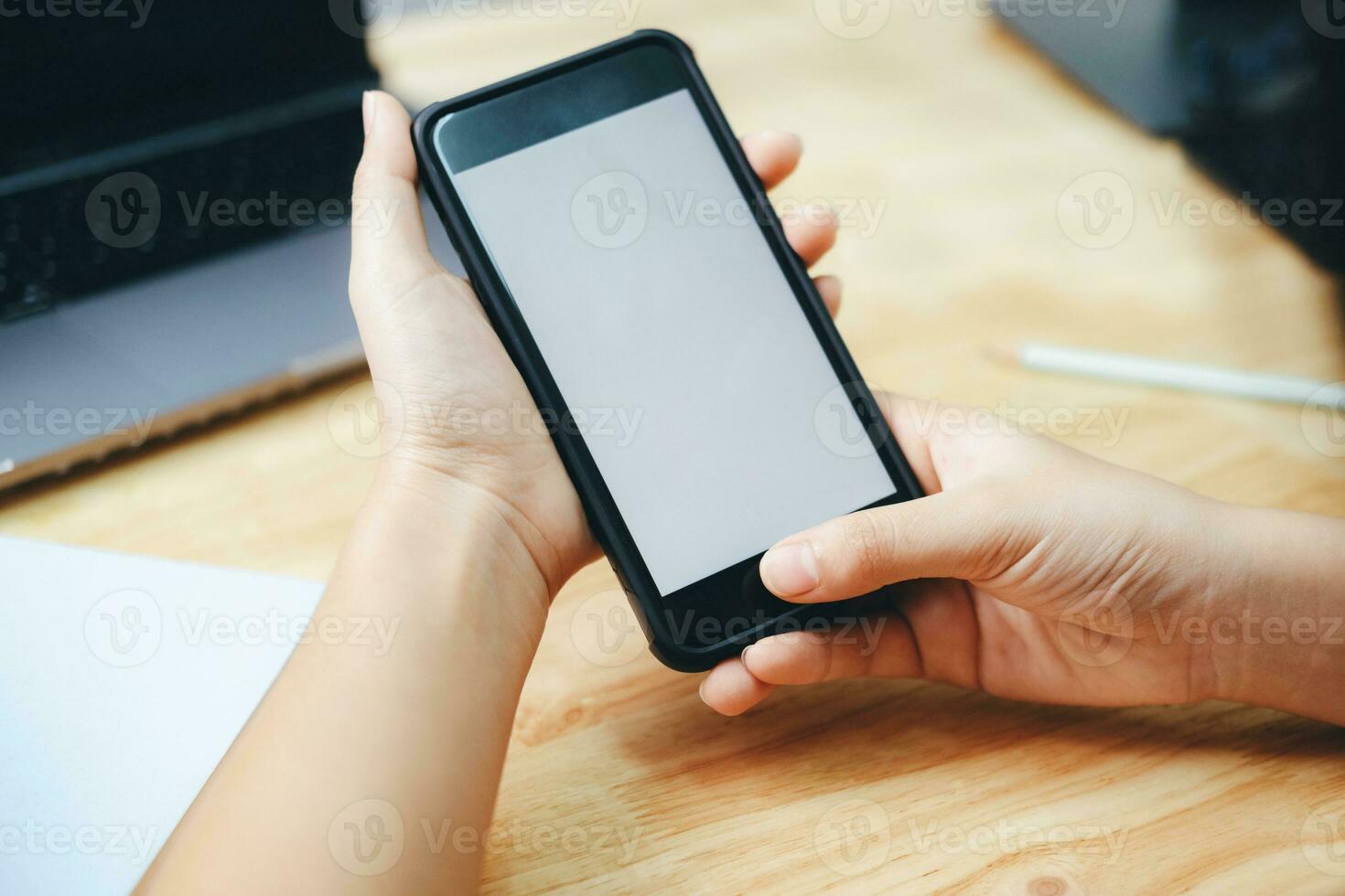 Close up of man hand holding smart phone. photo