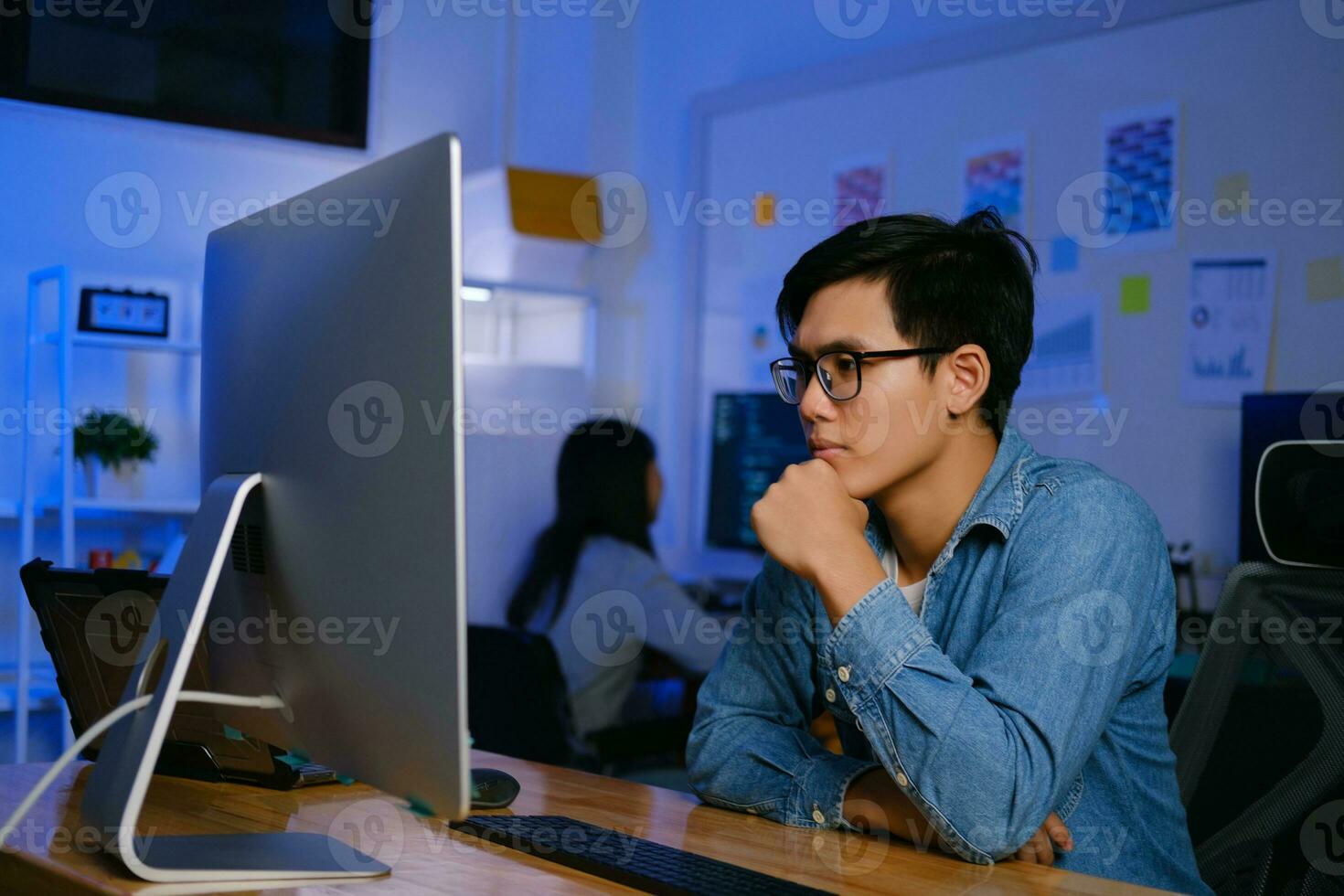 Programmers and developer teams are coding and developing software photo