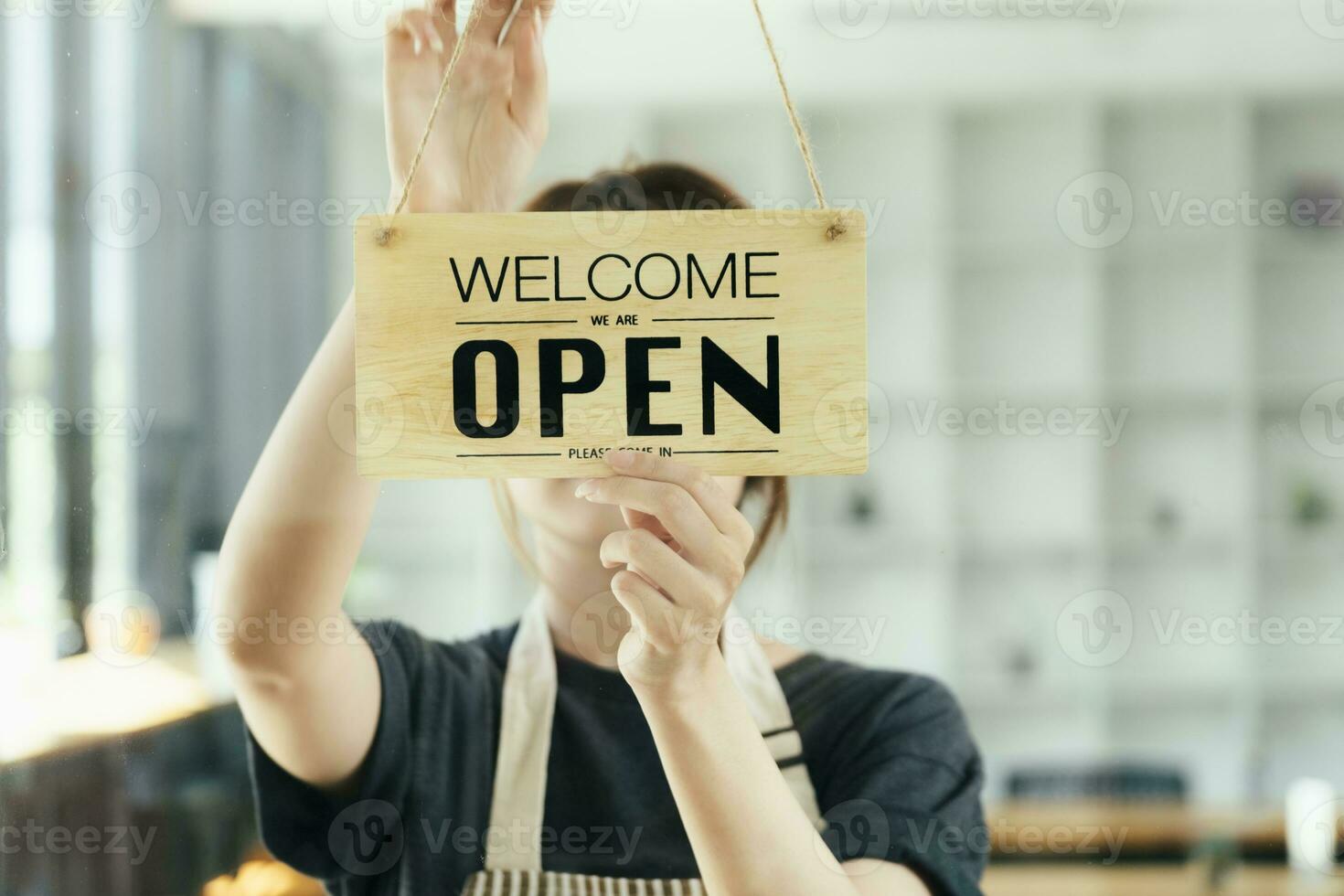Close up Young business owner open the coffee shop. photo