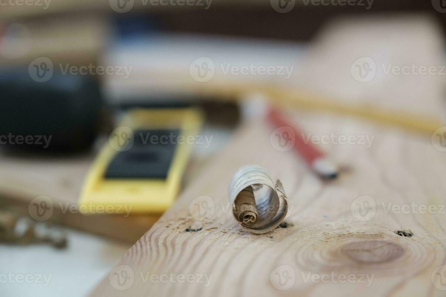 Close up of wood shavings on the carpenter's workbench. photo