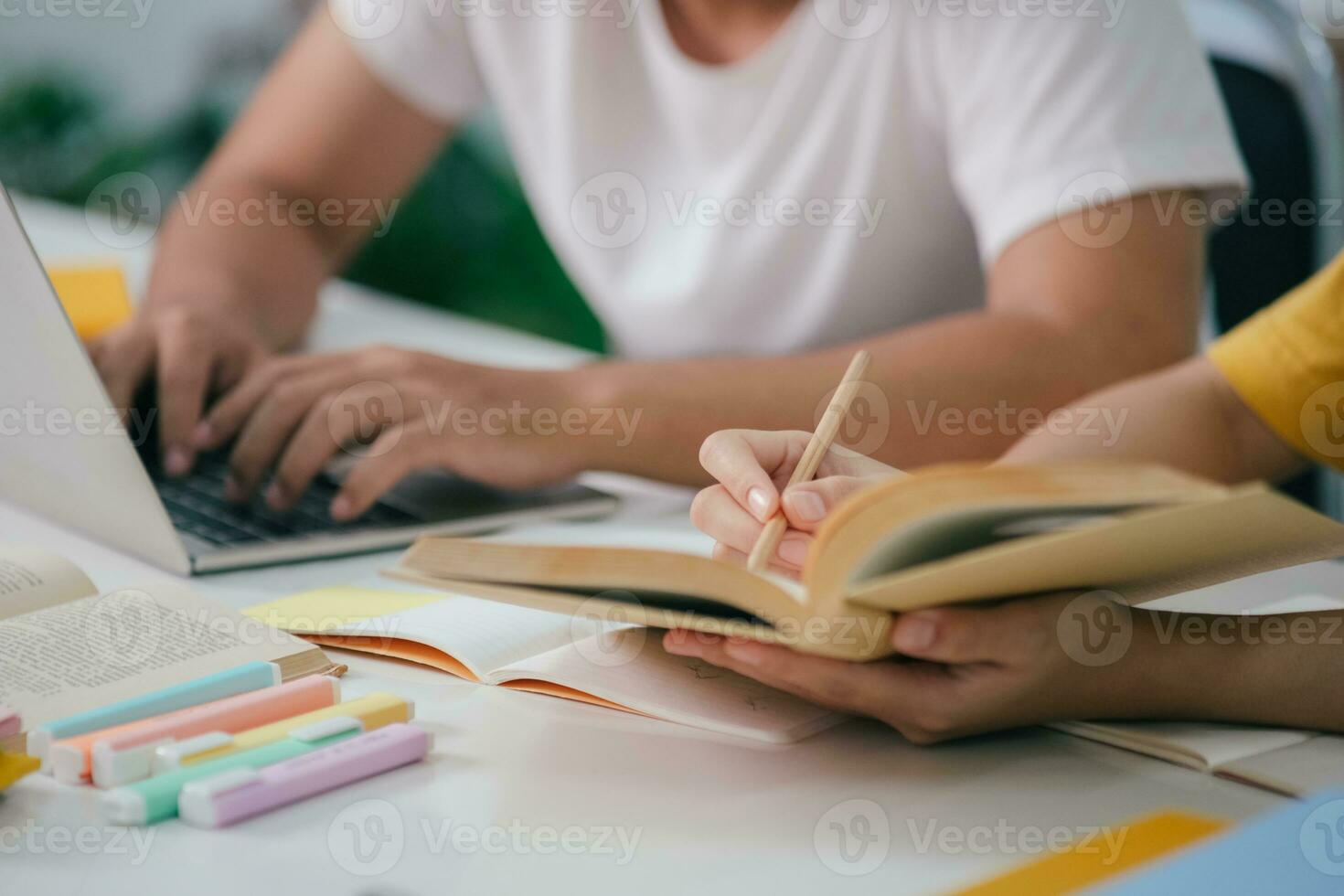 Young students campus helps friend catching up and learning. photo