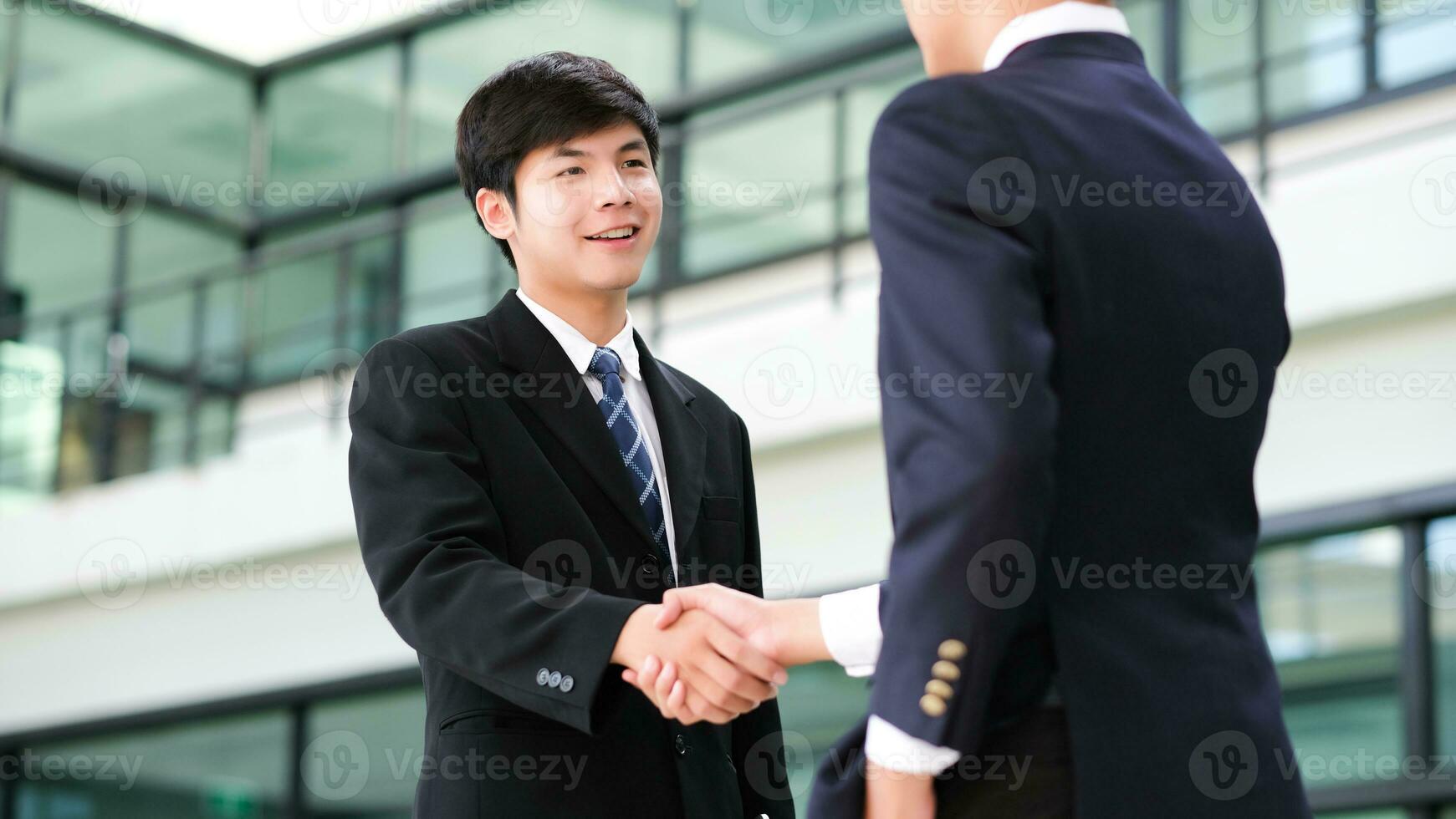 Businessmans handshake after good deal. photo