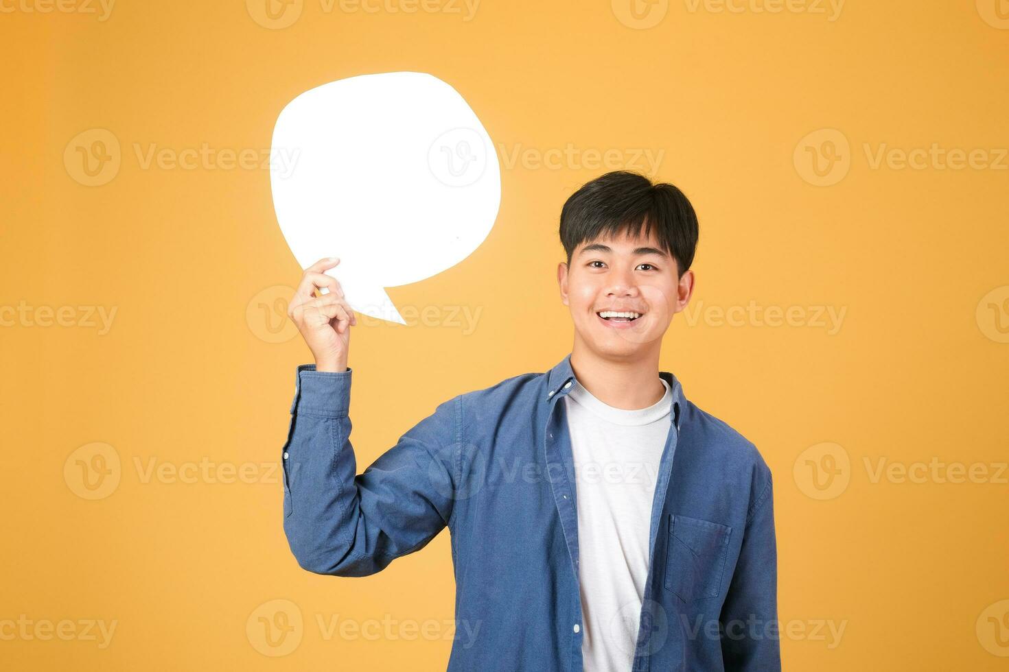 Asian man holding speech bubble. photo