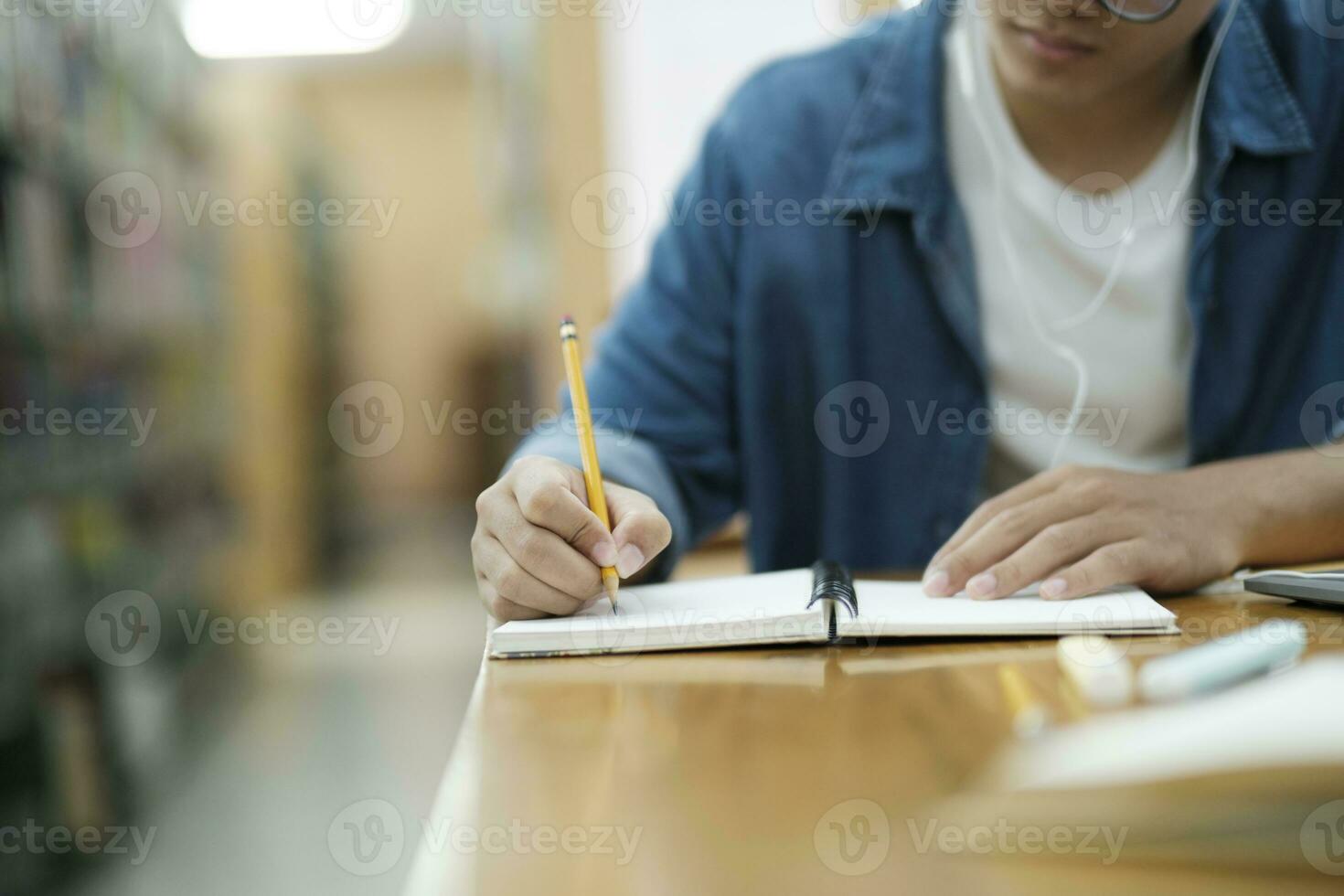 Student studying at library. photo
