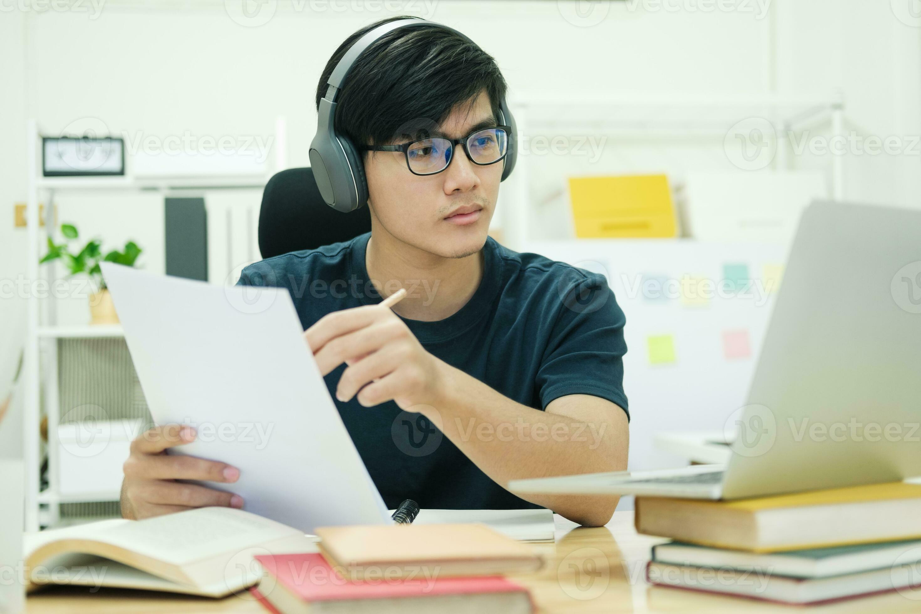 Young man study in front of the laptop computer at home 24772759 Stock ...