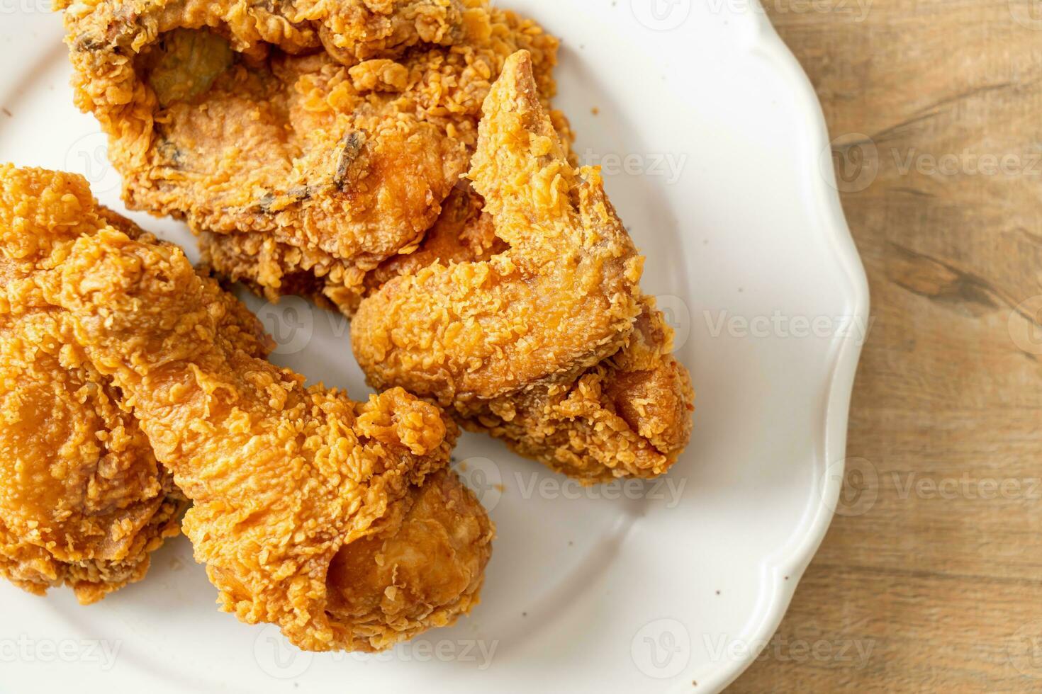 fried chicken with ketchup on plate photo