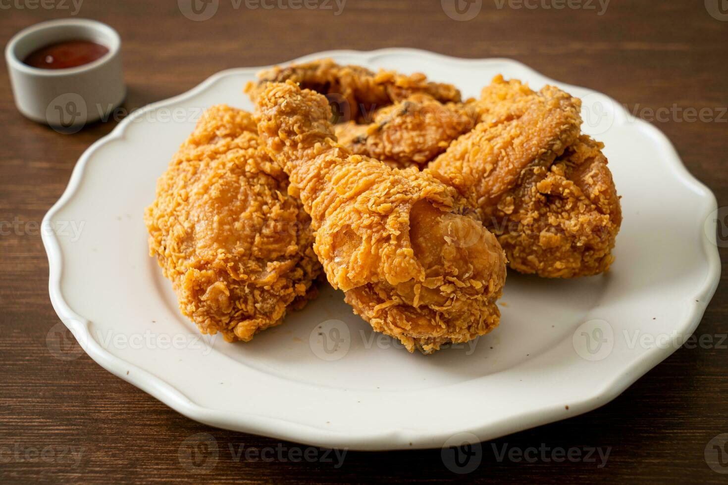 fried chicken with ketchup on plate photo