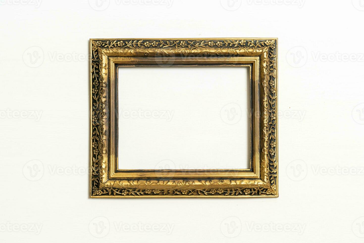 empty picture frame on white wall background photo