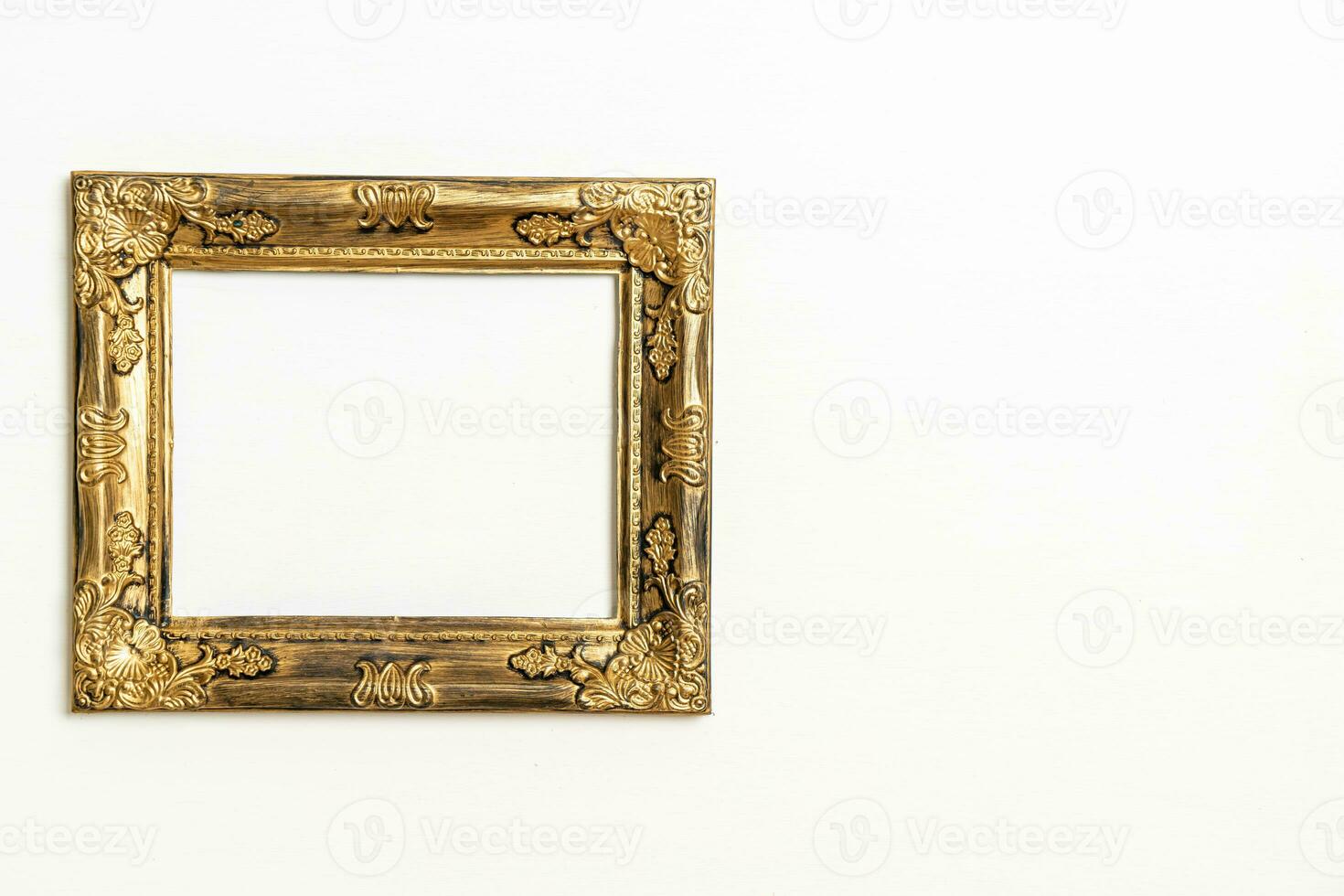 empty picture frame on white wall background photo