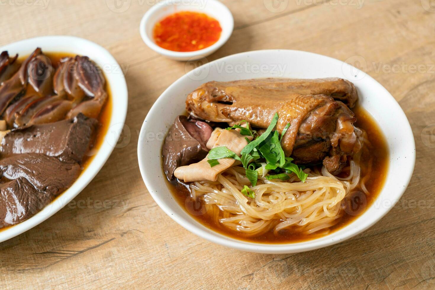 Braised duck noodles with brown soup photo
