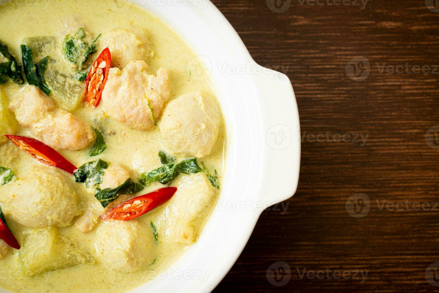 green curry soup with minced pork and meat ball photo
